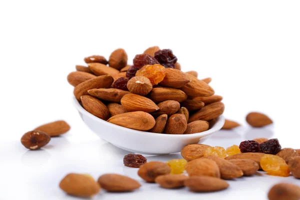 Almonds on a white plate — Stock Photo, Image