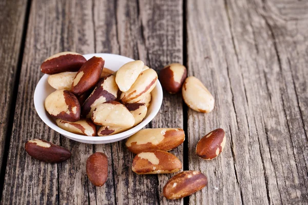 Brazil nuts on a wooden background. — Stock Photo, Image