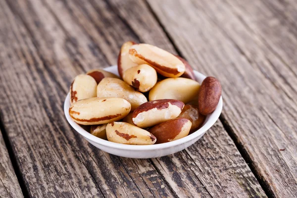 Brazil nuts on a wooden background. — Stock Photo, Image