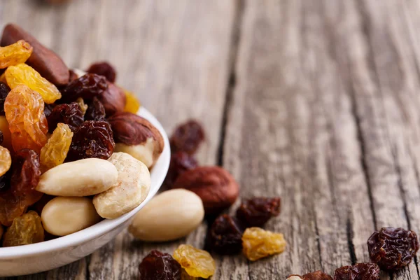 Mixed nuts on a white plate. — Stock Photo, Image