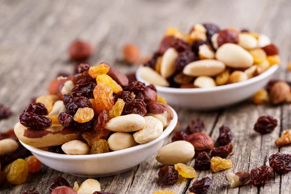 Mixed nuts on a white plate. — Stock Photo, Image