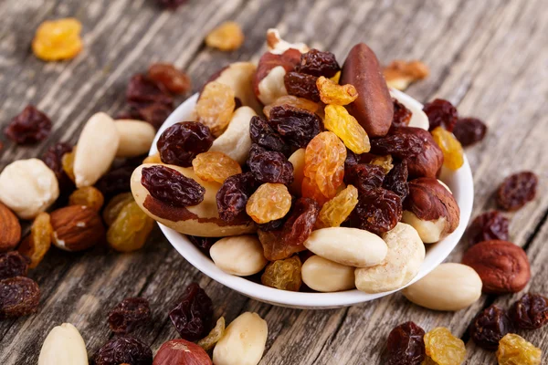 Mixed nuts on a white plate. — Stock Photo, Image