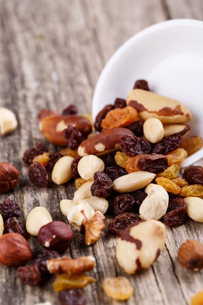 Mixed nuts on a white plate. — Stock Photo, Image