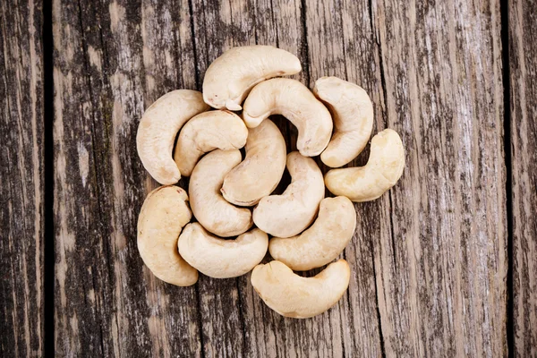 Cashew nuts on wooden background. — Stock Photo, Image