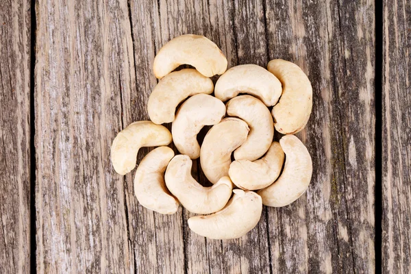 Cashew nuts on wooden background. — Stock Photo, Image