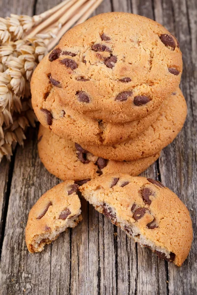 Tasty cookies with wheat on a wooden table. — Stock Photo, Image