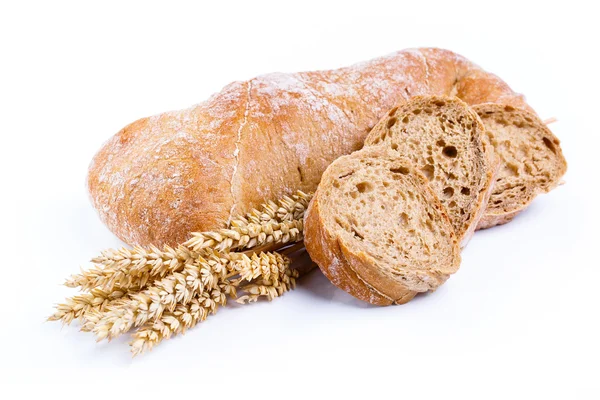 Tasty bread with wheat on a white background. — Stock Photo, Image