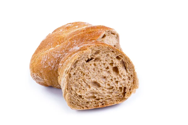 Tasty bread with slices on a white background. — Stock Photo, Image