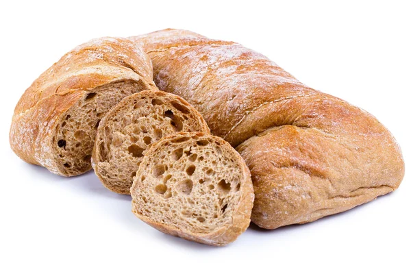 Tasty bread with slices on a white background. — Stock Photo, Image