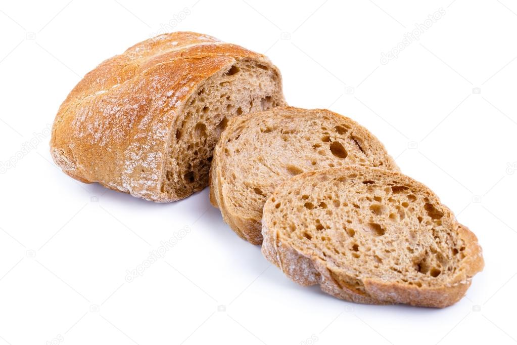 Tasty bread with slices on a white background.