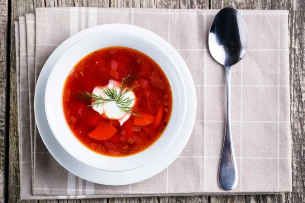 Tasty soup with bread on a wooden background. — Stock Photo, Image