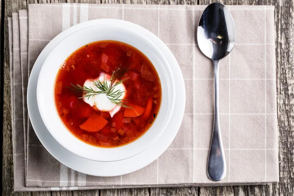 Tasty soup with bread on a wooden background. — Stock Photo, Image