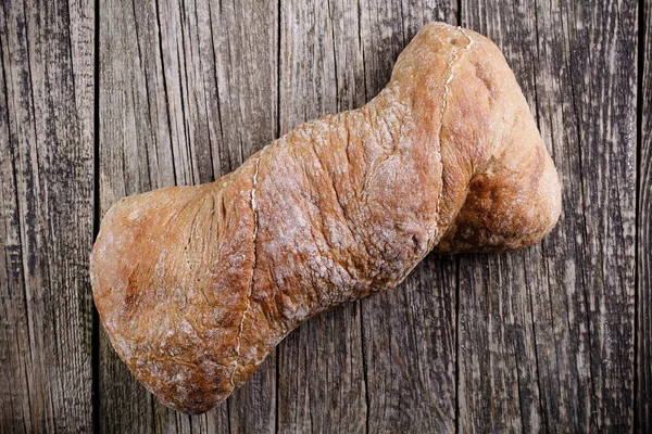 Tasty bread on wooden background. — Stock Photo, Image