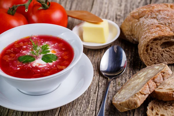 Tasty soup with bread on a wooden background. — Stock Photo, Image