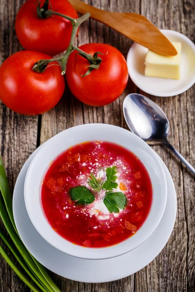 Tasty soup with bread on a wooden background. — Stock Image Tasty soup with bread on a wooden background. Royalty Free Stock Images
