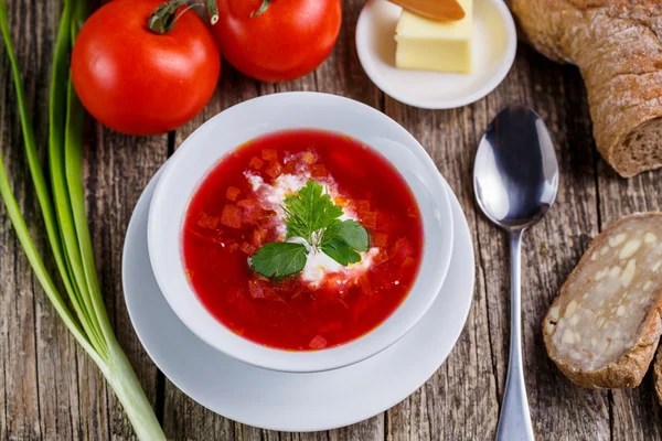 Tasty soup with bread on a wooden background. — Stock Photo, Image