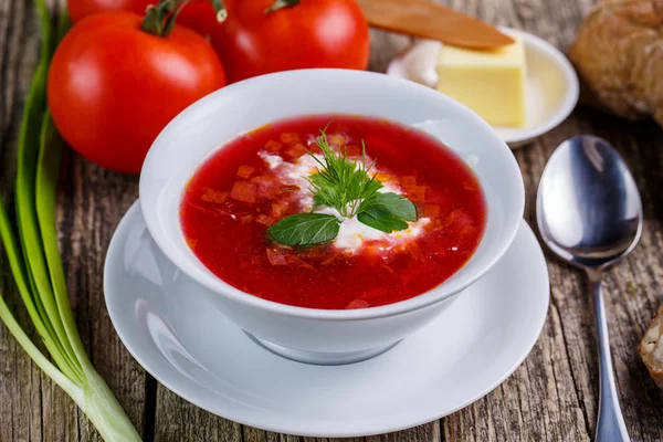 Tasty soup with bread on a wooden background. — Stock Photo, Image