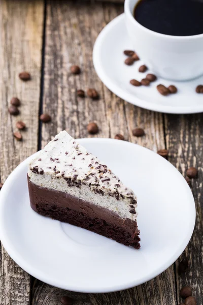 Chocolate dessert with coffee cup and coffee beans on wooden bac — Stock Photo, Image