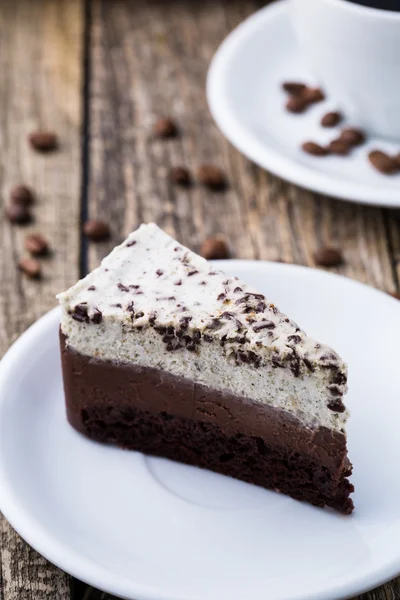 Chocolate dessert with coffee cup and coffee beans on wooden bac — Stock Photo, Image