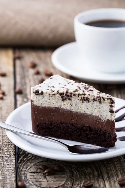 Chocolate dessert with coffee cup and coffee beans on wooden bac — Stock Photo, Image