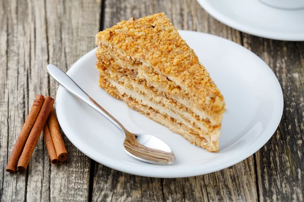 Tasty honey cake on wooden background. — Stock Photo, Image