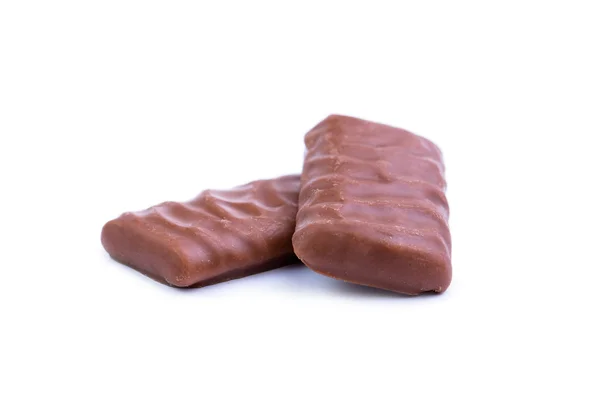 Caramelos de chocolate sobre un fondo blanco. — Foto de Stock