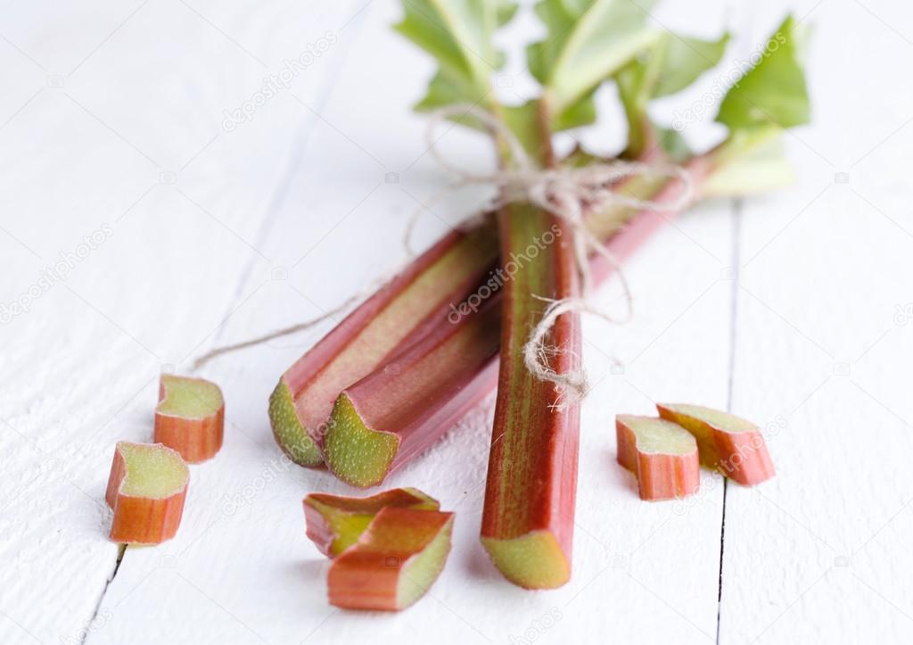 Rhubarb on white wooden table.