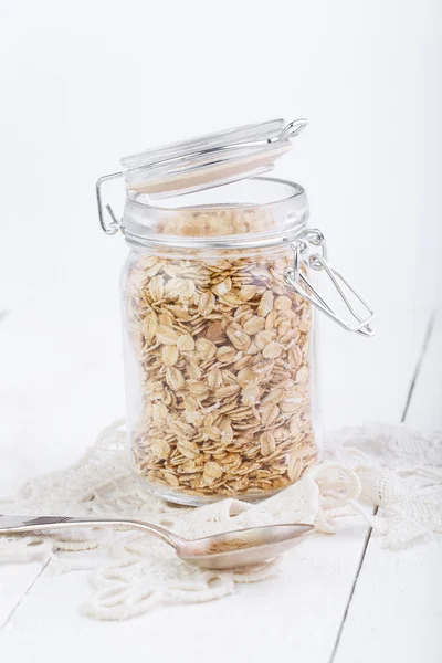 The oat flakes in glass jar. — Stock Photo, Image