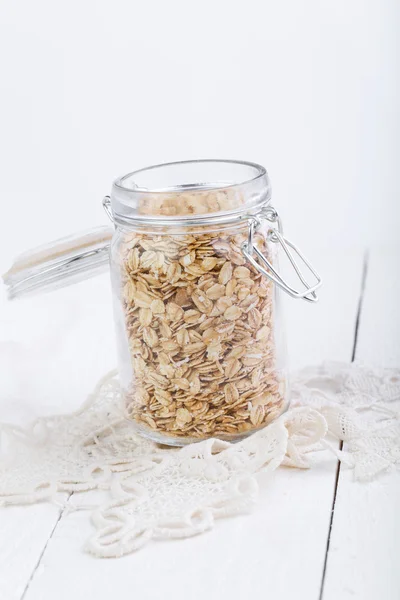 The oat flakes in glass jar. — Stock Photo, Image