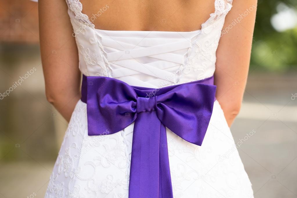 Beautiful brides wedding dress with bow.