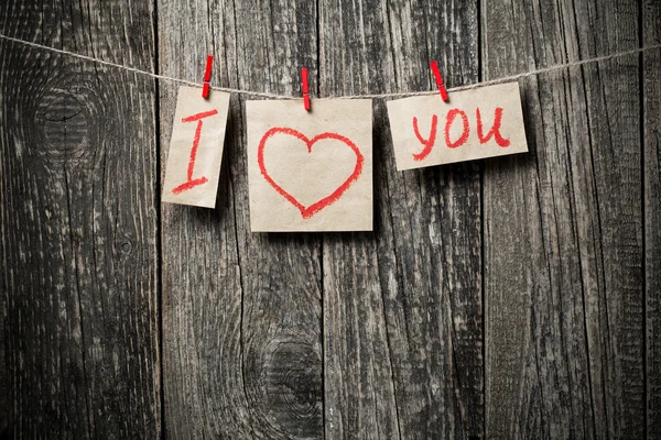 Рукописні слова, які я люблю тебе і серця на дерев'яному тлі . — стокове фото