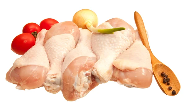 Raw chicken legs with vegetables, isolated on white background — Stock Photo, Image