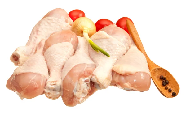 Raw chicken legs with vegetables, isolated on white background — Stock Photo, Image