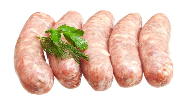 Raw meat sausages with greens isolated on white background — Stock Photo, Image