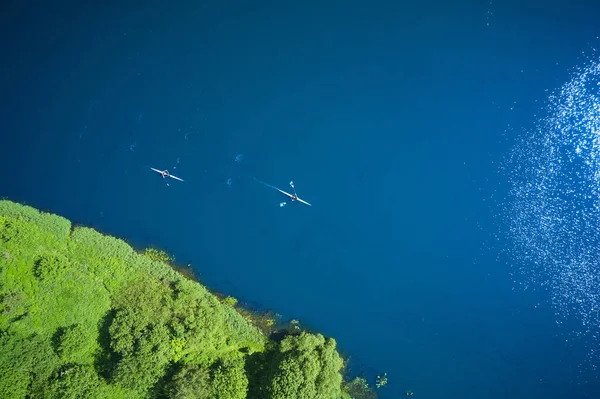 Two sports canoes from a bird\'s eye view.