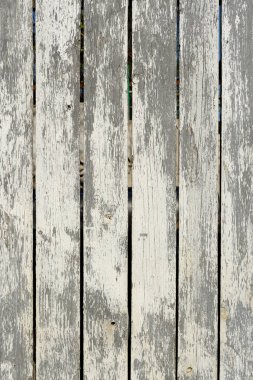 Ahşap dokular, eski beyaz çizilmiş boyayla soyut bir yüzey oluşturuyor..