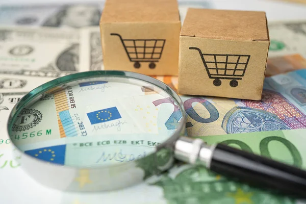 Shopping cart logo on box with US dollar and Euro banknotes background, Banking Account, Investment Analytic research data economy, trading, Business import export online company concept.
