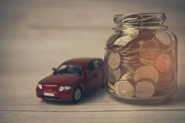 Car with coins; Car loan, Finance, saving money, insurance and leasing time concepts.