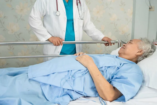 Asian senior or elderly old woman patient lie down  with hope on a bed in the hospital.