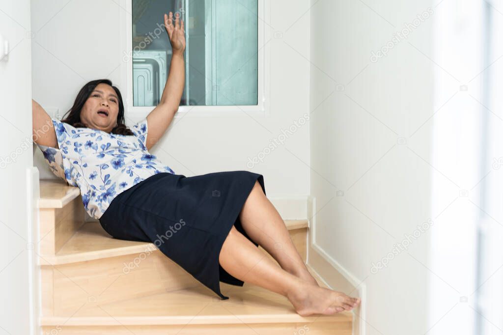 Asian middle-aged lady woman patient fall down the stairs because slippery surfaces