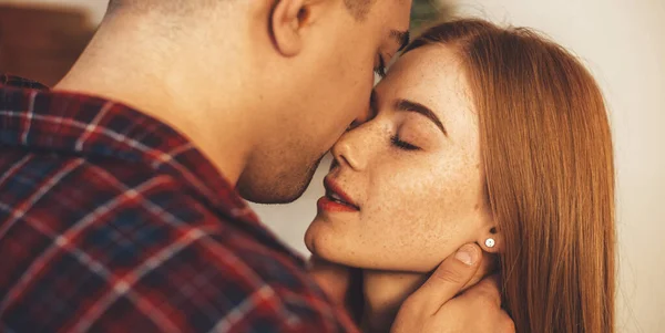 Close up photo of a caucasian ginger lady with freckles embracing with her lover having a intimate moment together — Stock Photo, Image