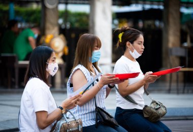 Editorial: Bangkok, Thailand, 5th Jan 2021. An Asian woman praying by wear a mask to avoid and protect against the COVID-19 outbreak in Bangkok, Thailand.