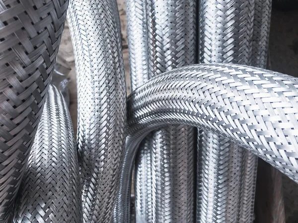 Long metal flexible compensator pipes metal texture