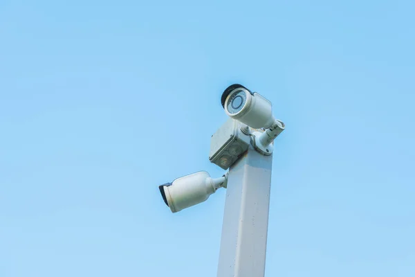 Old Security Cameras Gray Pole Blue Sky Background Royalty Free Stock Photos