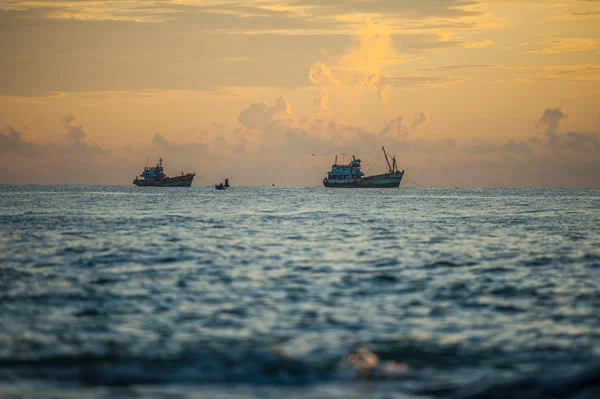 A little boat in sunset on the sea — Stock Photo, Image