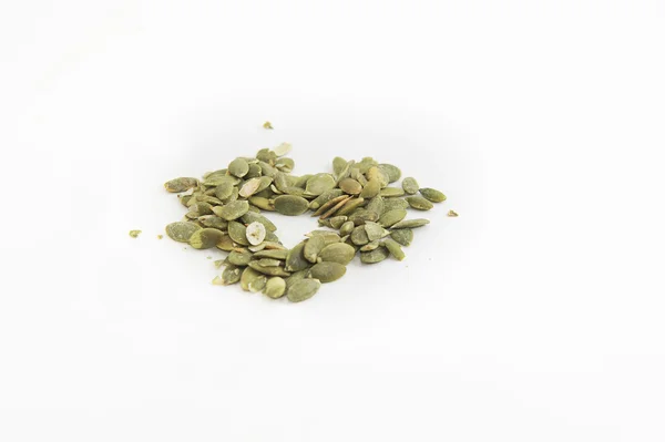 Pumpkin seeds and white background — Stock Photo, Image