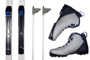 Winter sport equipment: cross-country ski, ski poles and shoes. Isolated on white with clipping path clipart