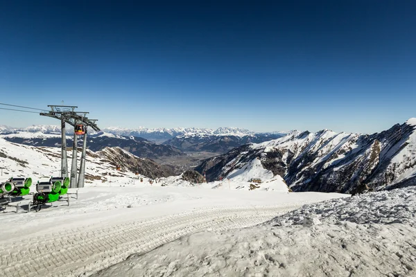 Mountain ski view with snow guns and chair lifts — Stock Photo, Image