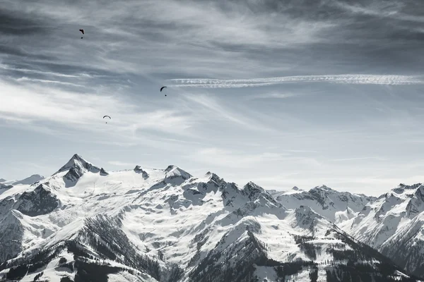 Beautiful mountain landscape with paragliders Stock Photo