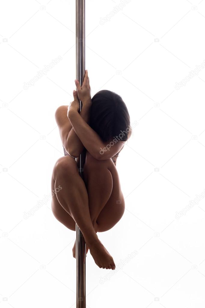 Beautiful young woman exercise pole dance